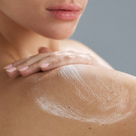 Dermalogica body hydrating cream bottle with text highlighting its benefits on a white background