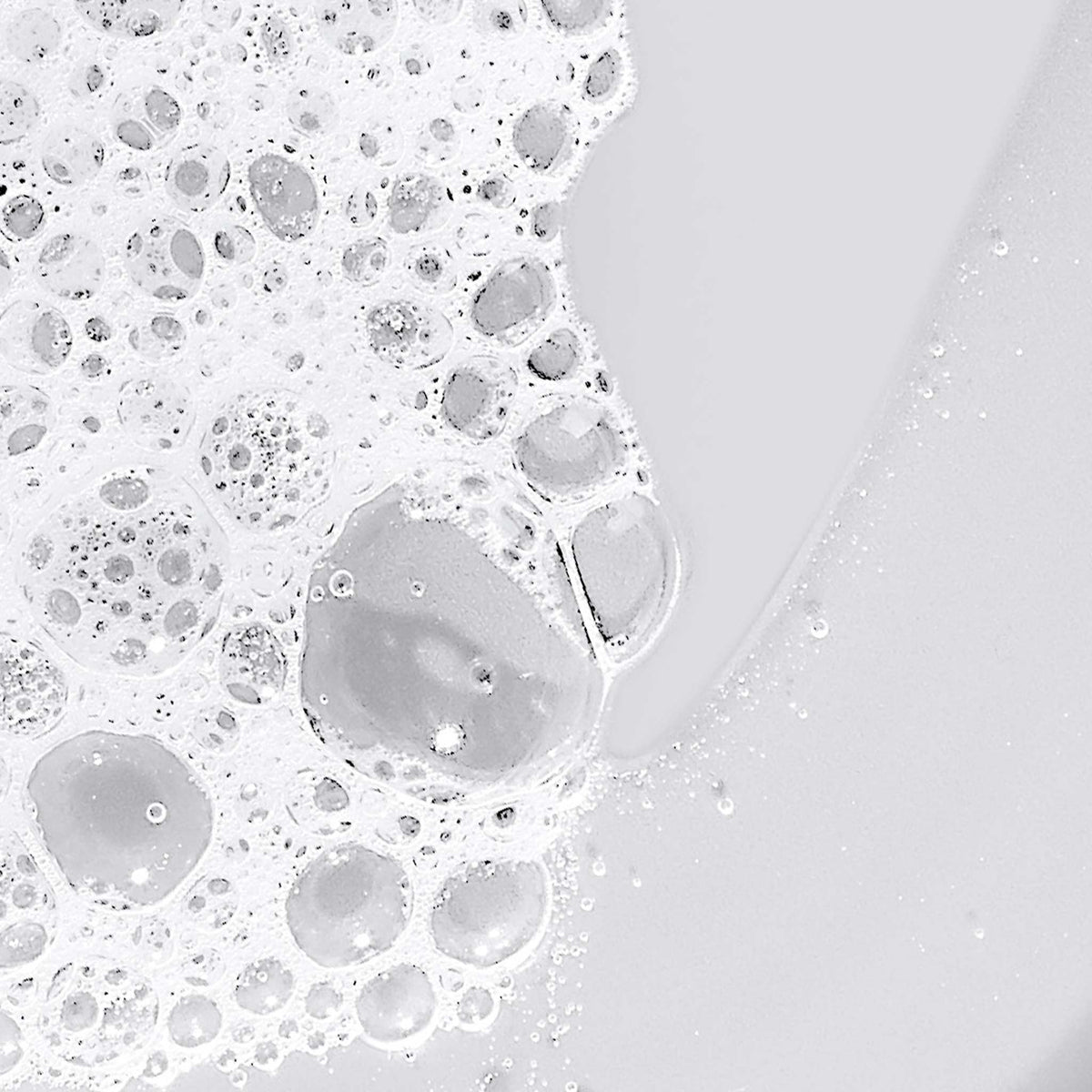 Close-up of soap bubbles on a white surface