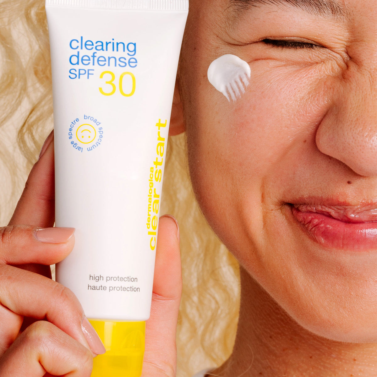 model holding clearing defense spf30 