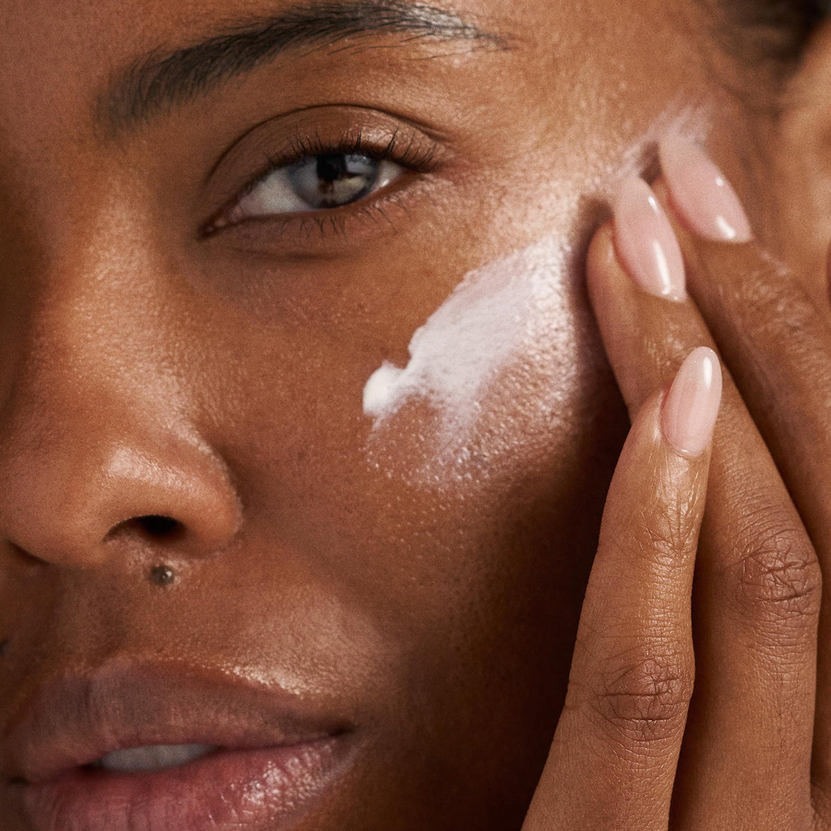 get + keep your glow model with product on face 