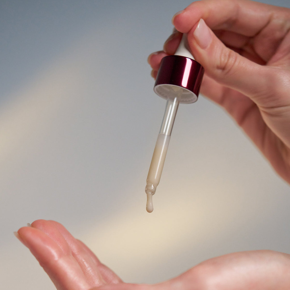 dynamic skin strengthening serum being dispensed 