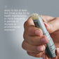 Hand holding a lip balm with text on a gray background