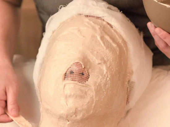 woman receving facial treatment