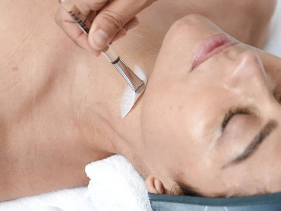 woman receiving treatment with fan brush