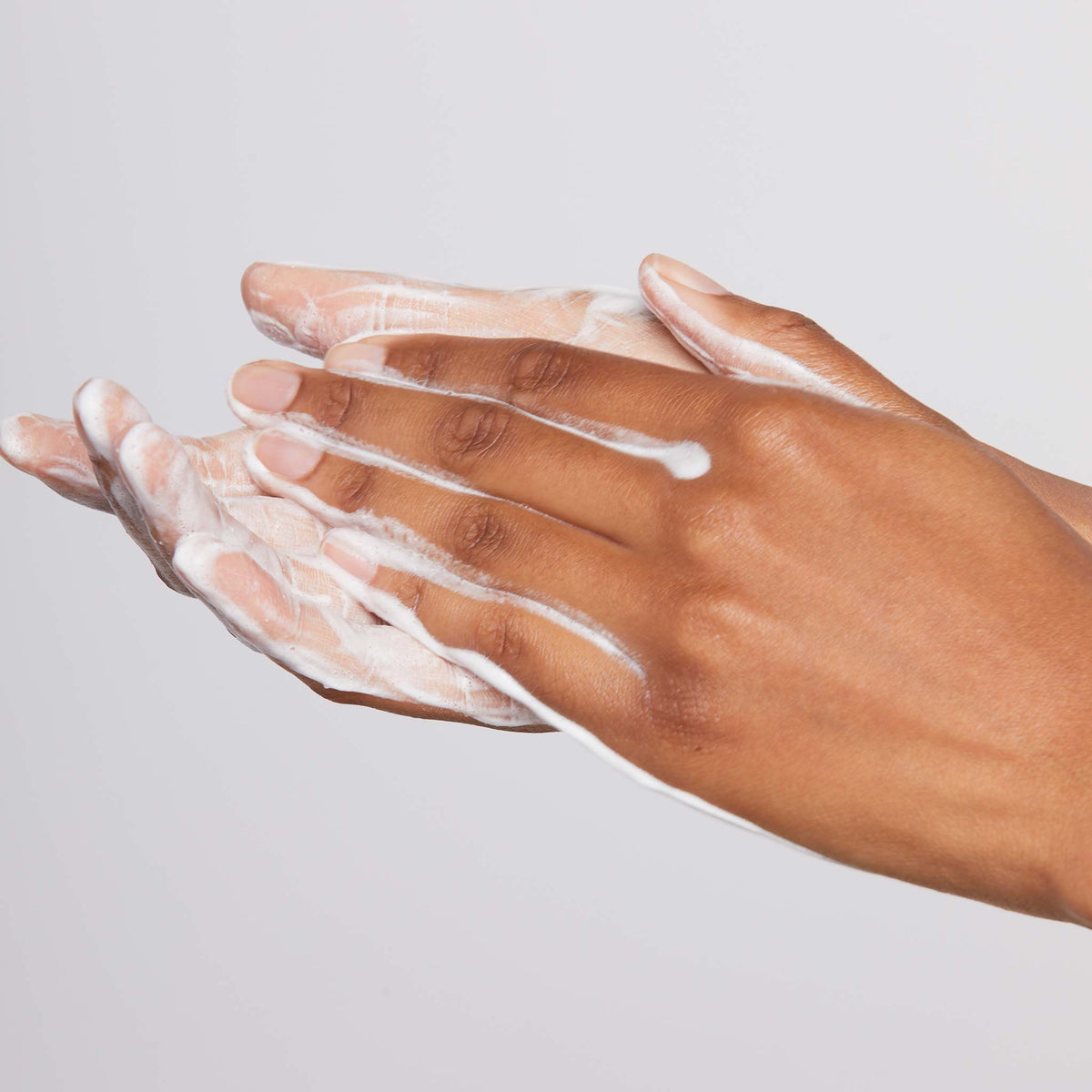 hands lathering daily microfoliant 