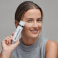 woman holding powerbright moisturizer spf50